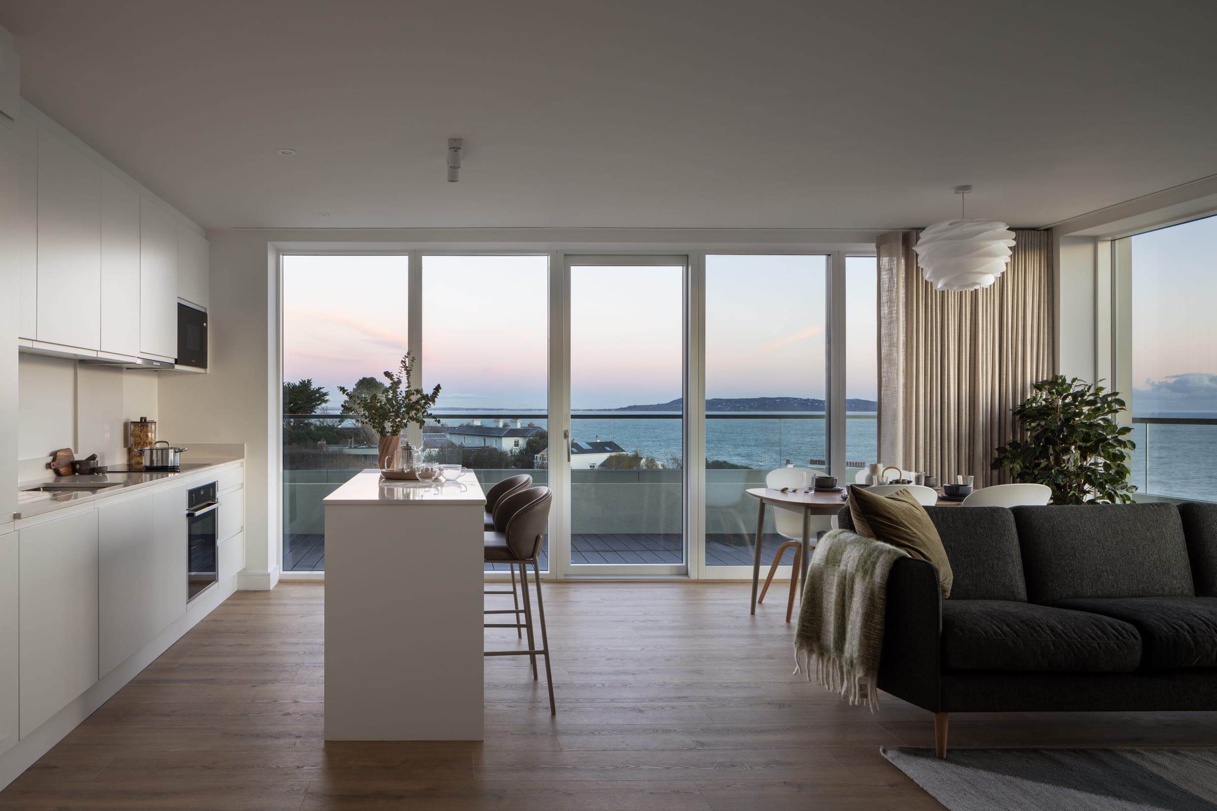 The Lookout, Harbour Road, Dalkey — the completed apartment building above the harbour, with landscaped grounds and the sea beyond