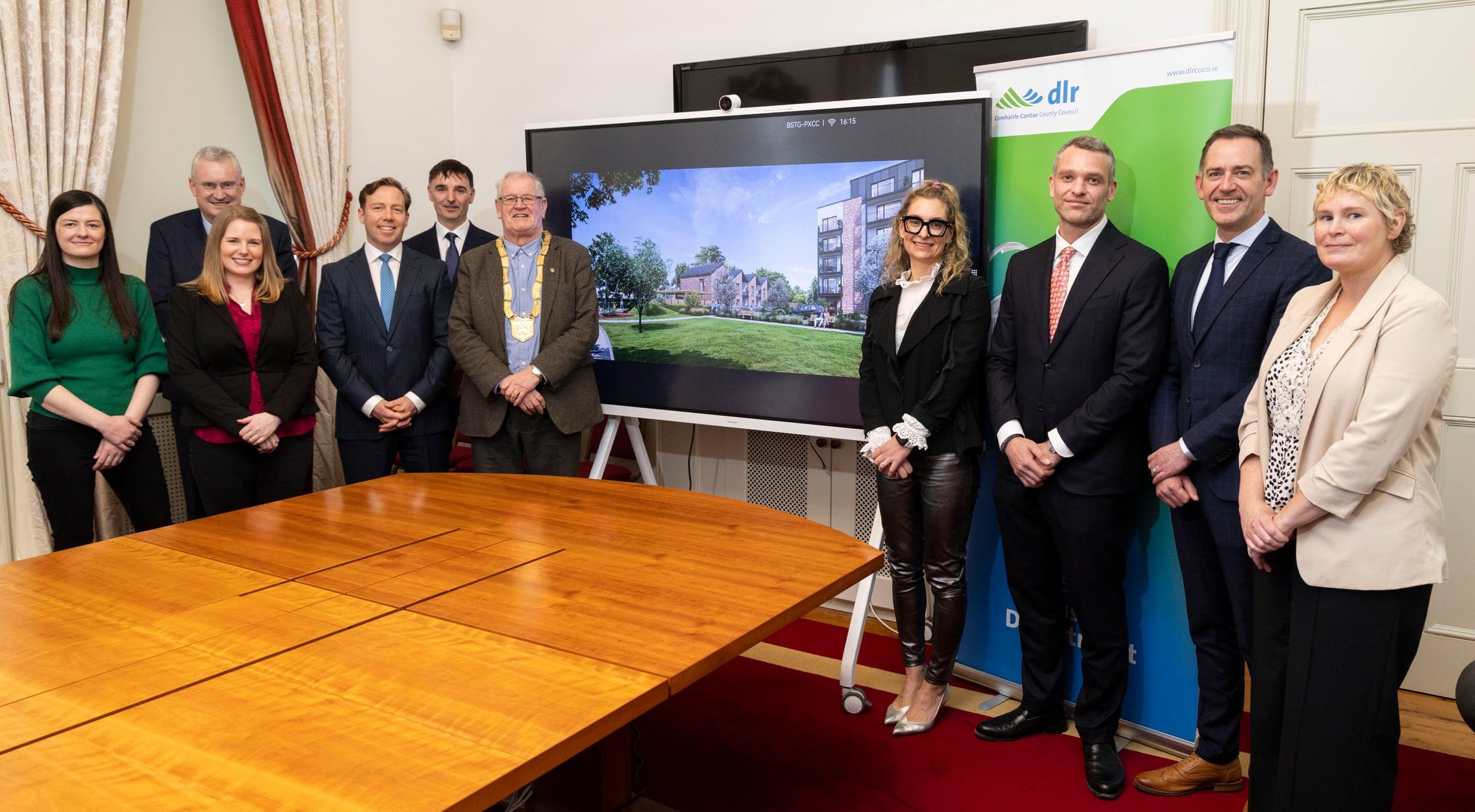 The Winterbrook and Dún Laoghaire–Rathdown County Council teams at the Emmet Gardens contract signing, with the scheme shown on screen